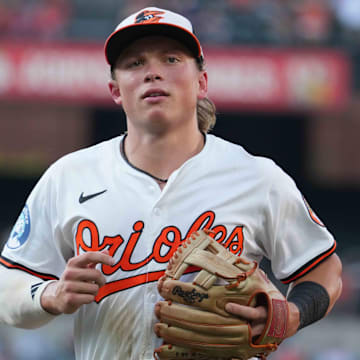 Jul 29, 2025; Baltimore, Maryland, USA; Baltimore Orioles second baseman Jackson Holliday (7) returns to the dugout at the end of the second inning against the Toronto Blue Jays at Oriole Park at Camden Yards. Mandatory Credit: Mitch Stringer-Imagn Images