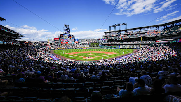 General wide angle view of Coors Field during a game, with fans filling in the lower deck of the field. 