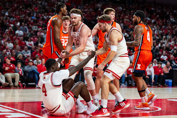 Nebraska Cornhuskers forward Juwan Gary (4) is helped up by forward Andrew Morgan (23) and guard Sam Hoiberg (1).