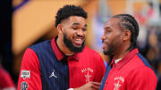 Feb 18, 2024; Indianapolis, Indiana, USA; Western Conference center Karl-Anthony Towns (32) of the Minnesota Timberwolves talks with forward Kawhi Leonard (2) of the LA Clippers before the 73rd NBA All Star game at Gainbridge Fieldhouse.