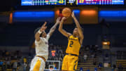 Cal Golden Bears forward Monty Bowser shoots over an Arizona State defender in 2023
