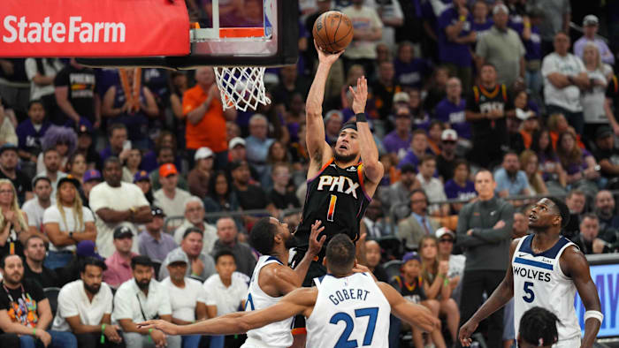 Apr 28, 2024; Phoenix, Arizona, USA; Phoenix Suns guard Devin Booker (1) shoots against the