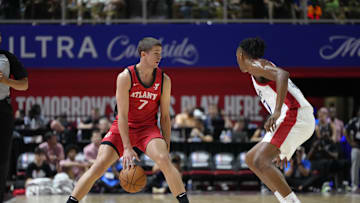 Jul 12, 2024; Las Vegas, NV, USA;  Atlanta Hawks forward/guard Nikola Durisic (7) controls the ball against Washington Wizards guard Bub Carrington (17) during the first half at Thomas & Mack Center. Mandatory Credit: Lucas Peltier-Imagn Images