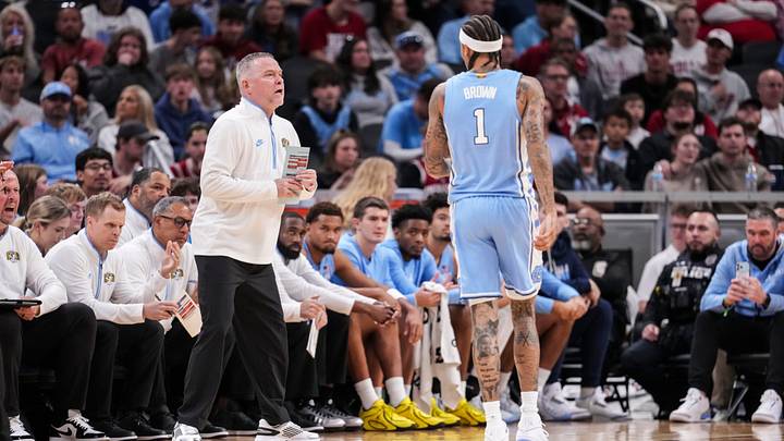 North Carolina Tar Heels head coach Michael Malone talks to North Carolina Tar Heels guard Terrence Brown (1) on Sunday, Oct. 18, 2026, during the first half of an exhibition game at Gainbridge Fieldhouse in Indianapolis.