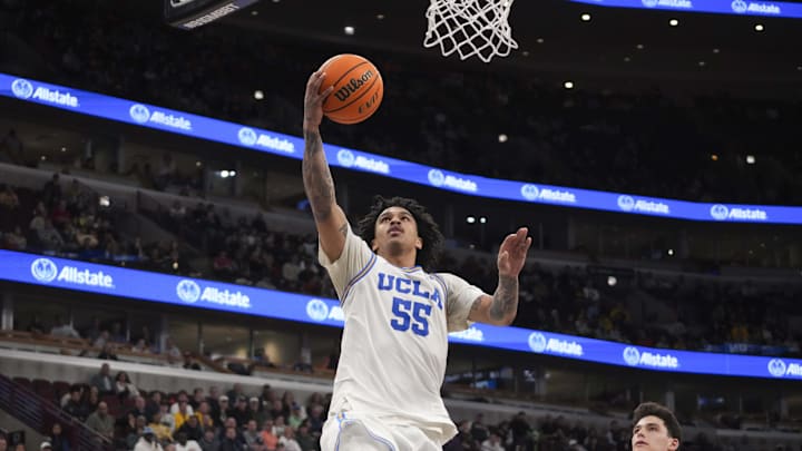 Mar 14, 2026; Chicago, IL, USA; UCLA Bruins guard Skyy Clark (55) goes to the basket on Purdue Boilermakers guard Omer Mayer (17) during the second half at United Center. Mandatory Credit: David Banks-Imagn Images