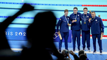 Jul 27, 2024; Nanterre, France; Jul 27, 2024; Nanterre, France; Chris Guiliano (USA), Jack Alexy (USA), Hunter Armstrong (USA) and Caeleb Dressel (USA) in the men’s 4 x 100-meter freestyle relay medal ceremony during the Paris 2024 Olympic Summer Games at Paris La Défense Arena. Mandatory Credit: Grace Hollars-USA TODAY Sports