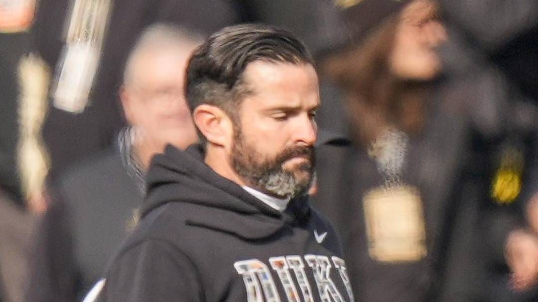 Nov 30, 2024; Winston-Salem, North Carolina, USA;  Duke Blue Devils head coach Manny Diaz leads his team onto the field against the Wake Forest Demon Deacons during the first half at Allegacy Federal Credit Union Stadium. Mandatory Credit: Jim Dedmon-Imagn Images