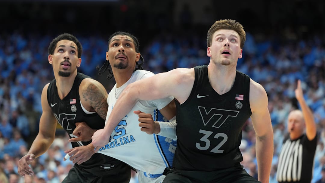 Feb 28, 2026; Chapel Hill, N.C.; Virginia Tech guard Jailen Bedford (0) and center Christian Gurdak (32) and North Carolina Tar Heels forward Jarin Stevenson (15) fight for a rebound.