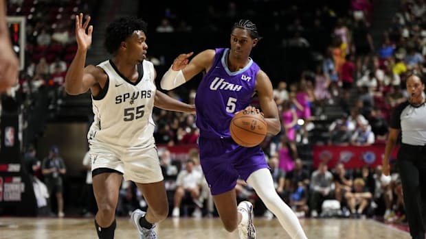 Jul 14, 2025; Las Vegas, NV, USA;  Utah Jazz forward Cody Williams (5) drives the ball against San Antonio Spurs guard Harris