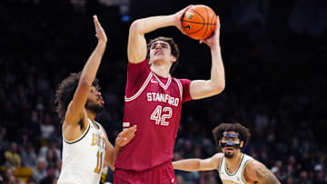 Mar 3, 2024; Boulder, Colorado, USA; Stanford Cardinal forward Maxime Raynaud (42) shoots over Colorado Buffaloes guard Javon Ruffin (11) in the first half at the CU Events Center. Mandatory Credit: Ron Chenoy-Imagn Images
