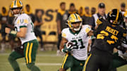 Edmonton Elks running back Justin Rankin (31) runs for a gain against the Hamilton Tiger-Cats during first half CFL football game action in Hamilton, Ont. on Saturday, August 17, 2024. Photo by Peter Power /The Canadian Press