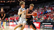 ADM's Hudson Lorensen (13) drives past Clear Lake's Trevor Theobald (11) during the Class 3A semifinal on Thursday, March 13, 2025, at Wells Fargo Arena.