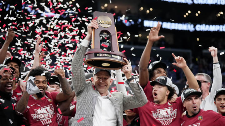 Mar 30, 2024; Los Angeles, CA, USA;  Alabama Crimson Tide head coach Nate Oats celebrates with the trophy after defeating the Clemson Tigers in the finals of the West Regional of the 2024 NCAA Tournament at Crypto.com Arena. Mandatory Credit: Kirby Lee-USA TODAY Sports