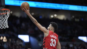 Mar 9, 2024; Portland, Oregon, USA;  Portland Trail Blazers forward Toumani Camara (33) shoots the ball against Toronto Raptors guard Javon Freeman-Liberty (0, left) during the second half at Moda Center. Mandatory Credit: Soobum Im-USA TODAY Sports