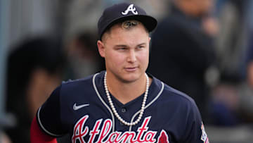 Oct 21, 2021; Los Angeles, California, USA; Atlanta Braves right fielder Joc Pederson (22) wears pearls in the dugout before game five of the 2021 NLCS against the Los Angeles Dodgers at Dodger Stadium.