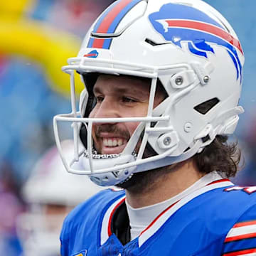 Bills quarterback Josh Allen smiles while warming up before a playoff game against the Broncos at Highmark Stadium on Jan. 12.
