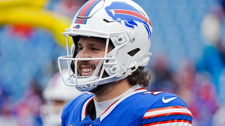 Bills quarterback Josh Allen smiles while warming up before a playoff game against the Broncos at Highmark Stadium on Jan. 12. Bills quarterback Josh Allen smiles while warming up before a playoff game against the Broncos at Highmark Stadium on Jan. 12.
