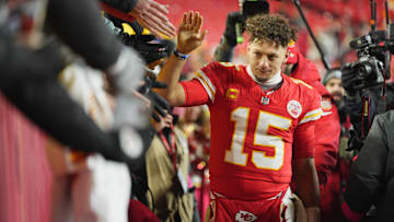 Jan 18, 2025; Kansas City, Missouri, USA; Kansas City Chiefs quarterback Patrick Mahomes (15) shakes hands with fans after defeating the Houston Texans in a 2025 AFC divisional round game at GEHA Field at Arrowhead Stadium. Mandatory Credit: Jay Biggerstaff-Imagn Images