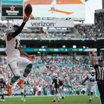 Miami Dolphins wide receiver Jaylen Waddle celebrates a touchdown against the New England Patriots
