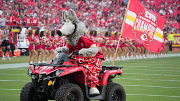 Aug 22, 2024; Kansas City, Missouri, USA; The Kansas City Chiefs mascot KC Wolf rides an atv on field against the Chicago Bears prior to a game at GEHA Field at Arrowhead Stadium. Mandatory Credit: Denny Medley-Imagn Images