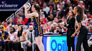Indiana Fever guard Caitlin Clark (22) scores a 3-pointer Saturday, June 14, 2025, during a game between the Indiana Fever and the New York Liberty at Gainbridge Fieldhouse in Indianapolis.