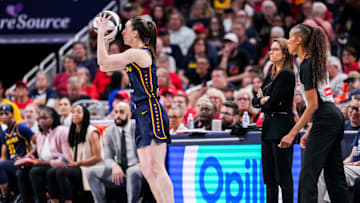 Indiana Fever guard Caitlin Clark (22) scores a 3-pointer Saturday, June 14, 2025, during a game between the Indiana Fever and the New York Liberty at Gainbridge Fieldhouse in Indianapolis.