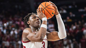 Adou Thiero (3) shoots a three against the Oklahoma Sooners inside Bud Walton Arena. The Sooners won 65-62.