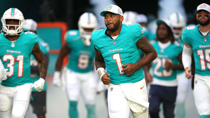 Miami Dolphins quarterback Tua Tagovailoa (1) takes to the field before the game against the Washington Commanders at Hard Rock Stadium.