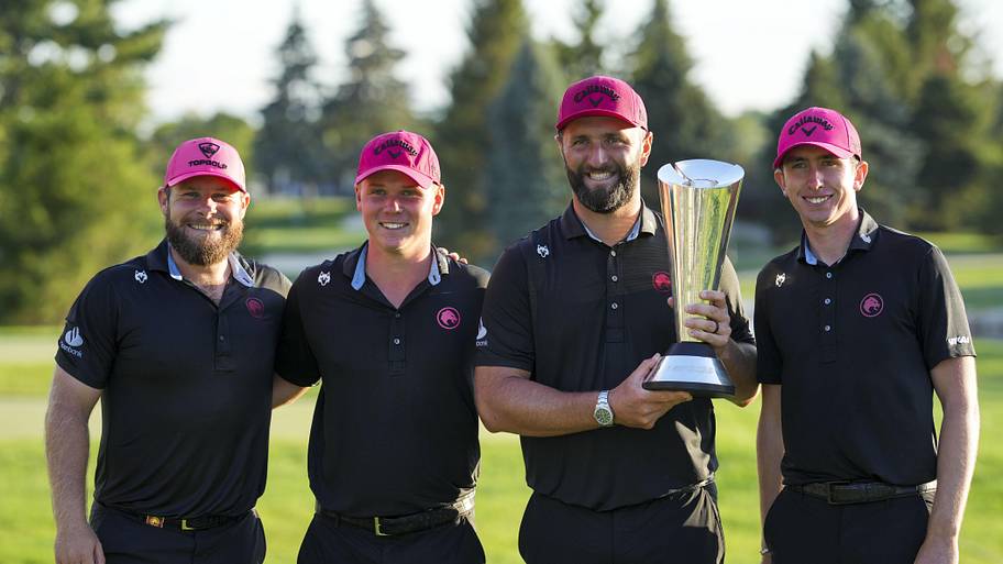 Members of Legion XIII pose for a photo with the trophy after the finals of the LIV Golf Michigan Team Championship in 2025. 