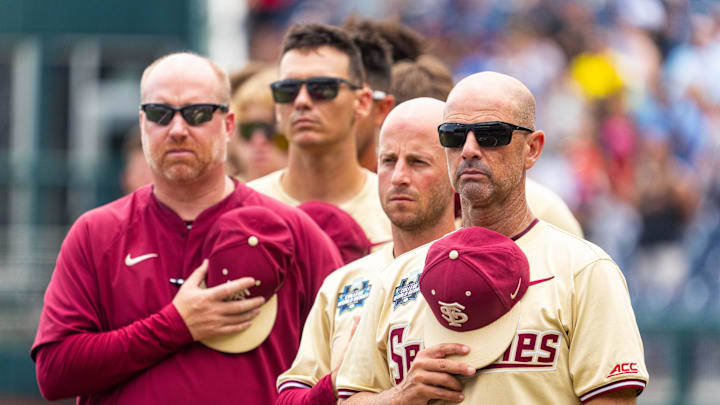 Jun 18, 2024; Omaha, NE, USA; Florida State Seminoles head coach Link Jarrett during the national anthem before the game against the North Carolina Tar Heels at Charles Schwab Field Omaha. Mandatory Credit: Dylan Widger-Imagn Images