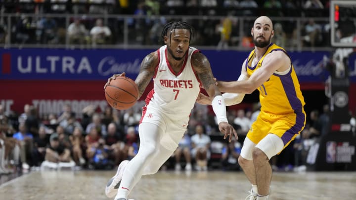 Jul 12, 2024; Las Vegas, NV, USA; Houston Rockets forward Cam Whitmore (7) drives the ball against Los Angeles Lakers guard Tommy Kuhse (31) during the first half at the Thomas & Mack Center. Mandatory Credit: Lucas Peltier-USA TODAY Sports