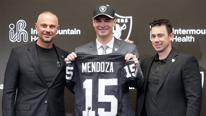 Las Vegas Raiders quarterback Fernando Mendoza (center) poses with jersey with general manager John Spytek (left) and head coach Klint Kubiak.