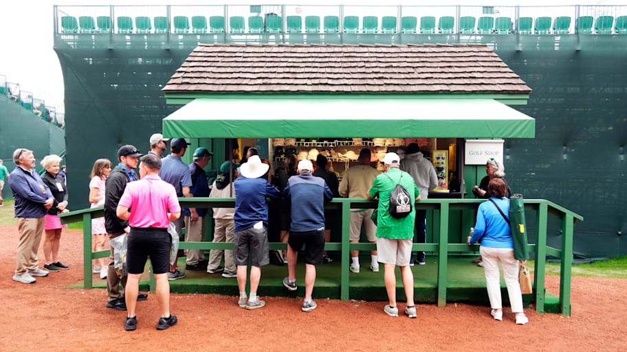 Patrons shop for merchandise behind the grandstand at no. 14 tee during a practice round for the 2023 Masters.