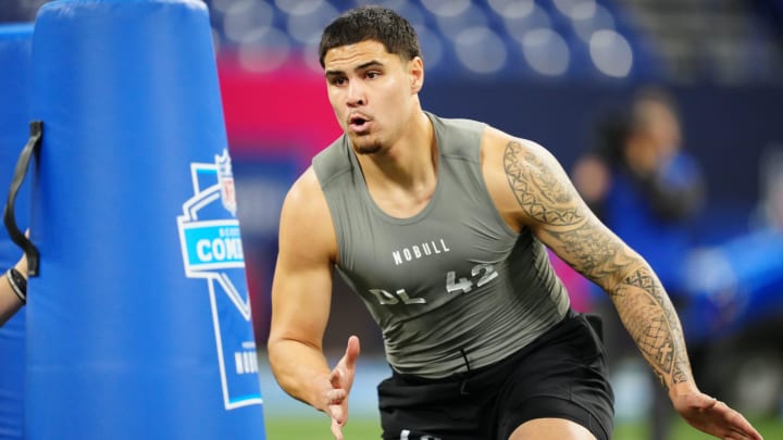 Feb 29, 2024; Indianapolis, IN, USA; UCLA defensive lineman Laiatu Latu (DL42) works out during the 2024 NFL Combine at Lucas Oil Stadium. Mandatory Credit: Kirby Lee-USA TODAY Sports