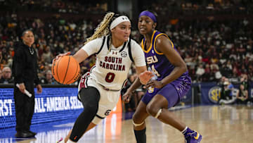 South Carolina basketball guard Te-Hina Paopao blowing by Flau'jae Johnson