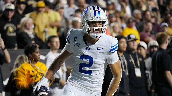 Sep 27, 2025; Boulder, Colorado, USA; Brigham Young Cougars wide receiver Chase Roberts (2) celebrates his touchdown reception in the second quarter against the Colorado Buffaloes at Folsom Field. Mandatory Credit: Ron Chenoy-Imagn Images