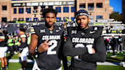 Nov 29, 2024; Boulder, Colorado, USA; Colorado Buffaloes quarterback Shedeur Sanders (2) and safety Shilo Sanders (21) before the game against the Oklahoma State Cowboys at Folsom Field. Mandatory Credit: Ron Chenoy-Imagn Images
