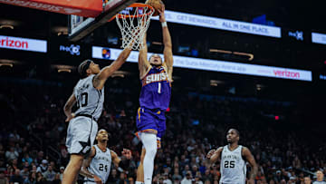 Nov 23, 2025; Phoenix, Arizona, USA;  Phoenix Suns guard Devin Booker (1) attempts a dunk in the first half of the game at Mortgage Match Up Center. Mandatory Credit: Arianna Grainey-Imagn Images
