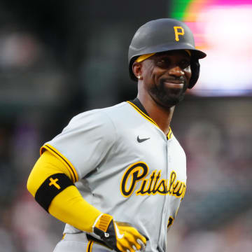 Jun 14, 2024; Denver, Colorado, USA; Pittsburgh Pirates outfielder Andrew McCutchen (22) reacts following his solo home run in the sixth inning at Coors Field. Mandatory Credit: Ron Chenoy-USA TODAY Sports