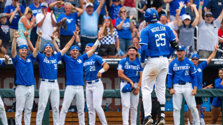 Jun 15, 2024; Omaha, NE, USA; The Kentucky Wildcats celebrate after a home run by first baseman Ryan Nicholson (25) against the NC State Wolfpack during the ninth inning at Charles Schwab Filed Omaha. Mandatory Credit: Dylan Widger-USA TODAY Sports