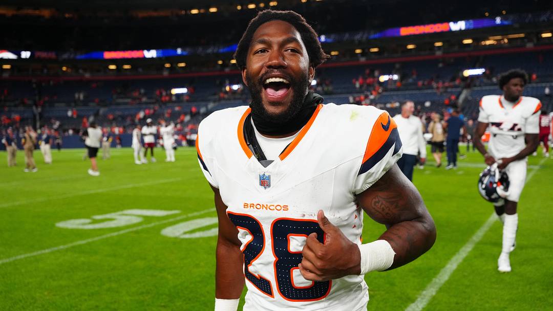Aug 16, 2025; Denver, Colorado, USA; Denver Broncos running back Tyler Badie (28) following the win against the against the Arizona Cardinals at Empower Field at Mile High. 