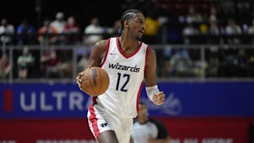 Jul 12, 2024; Las Vegas, NV, USA;  Washington Wizards center Alex Sarr (12) dribbles the ball against the Atlanta Hawks during the second half at Thomas & Mack Center. Mandatory Credit: Lucas Peltier-Imagn Images