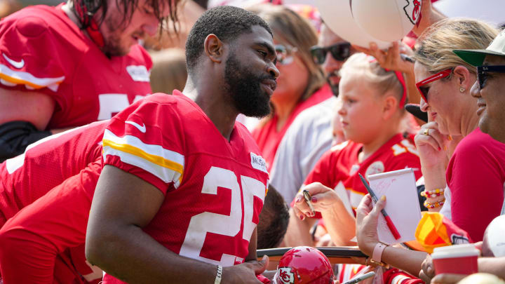 Jul 22, 2024; St. Joseph, MO, USA; Kansas City Chiefs running back Clyde Edwards-Helaire (25) signs autographs for fans after training camp at Missouri Western State University. Mandatory Credit: Denny Medley-USA TODAY Sports