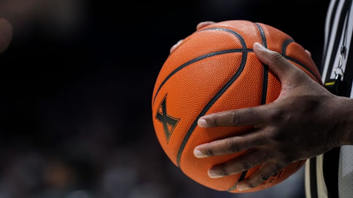 Jan 10, 2026; Cincinnati, Ohio, USA; An official holds the game ball during a stop in play between the Providence Friars and the Xavier Musketeers in the first half at the Cintas Center. Mandatory Credit: Aaron Doster-Imagn Images
