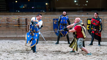 Buddy Valastro and Duff Goldman with Medieval Times cast members, as seen on Buddy vs Duff, Season 2. photo provided by Food Network