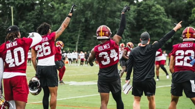 Washington Commanders defensive backs (left to right) Tyler Owens, Tariq Castro-Fields, Christian Holmes, and Darrick Forrest