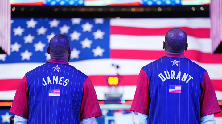 Feb 18, 2024; Indianapolis, Indiana, USA; Western Conference forward LeBron James (23) of the Los Angeles Lakers and forward Kevin Durant (35) of the Phoenix Suns look on during the national anthem before the 73rd NBA All Star game at Gainbridge Fieldhouse. Mandatory Credit: Kyle Terada-USA TODAY Sports