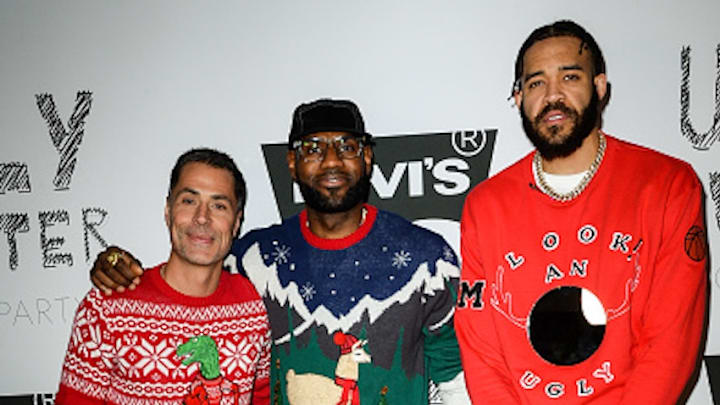 Rob Pelinka, LeBron James and JaVale McGee at an ugly Christmas sweater party in 2019.