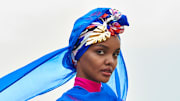 Halima Aden was photographed by Yu Tsai in Kenya. Burkini by Cover Swim. Barrette by LELET NY.
