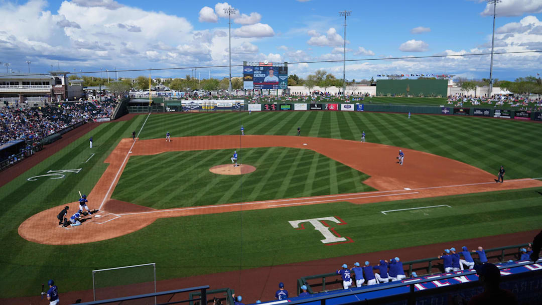Mar 8, 2024; Surprise, Arizona, USA; A general view of game action between the Texas Rangers and the Kansas City Royals during the third inning at Surprise Stadium. Mandatory Credit: Joe Camporeale-Imagn Images